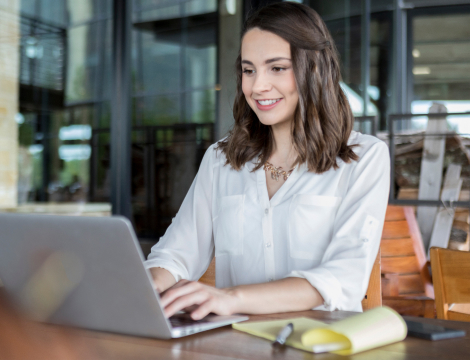 Business students with her laptop working