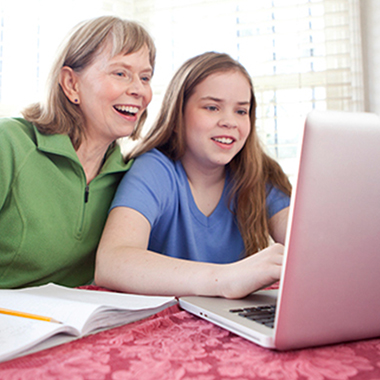 Mother and daughter with a laptop image