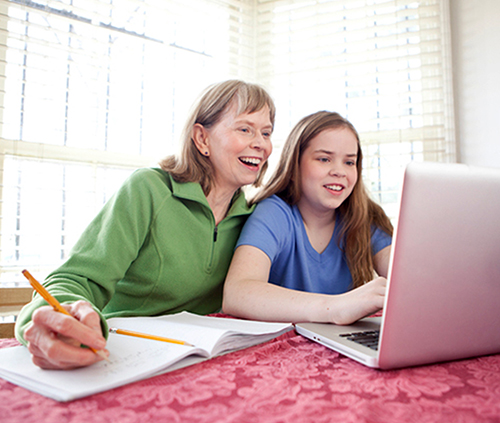 Mother and daughter with a laptop image
