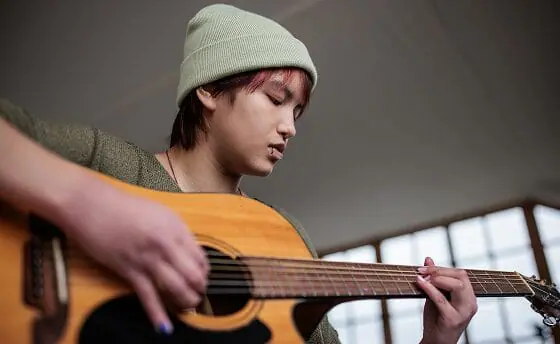 Student playing the guitar