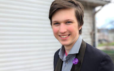 Boy wearing a suit smiling