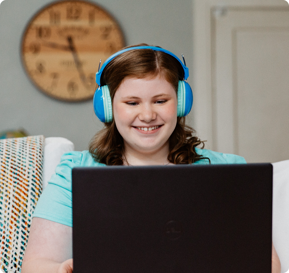 Student wearing a pair of blue headphones
